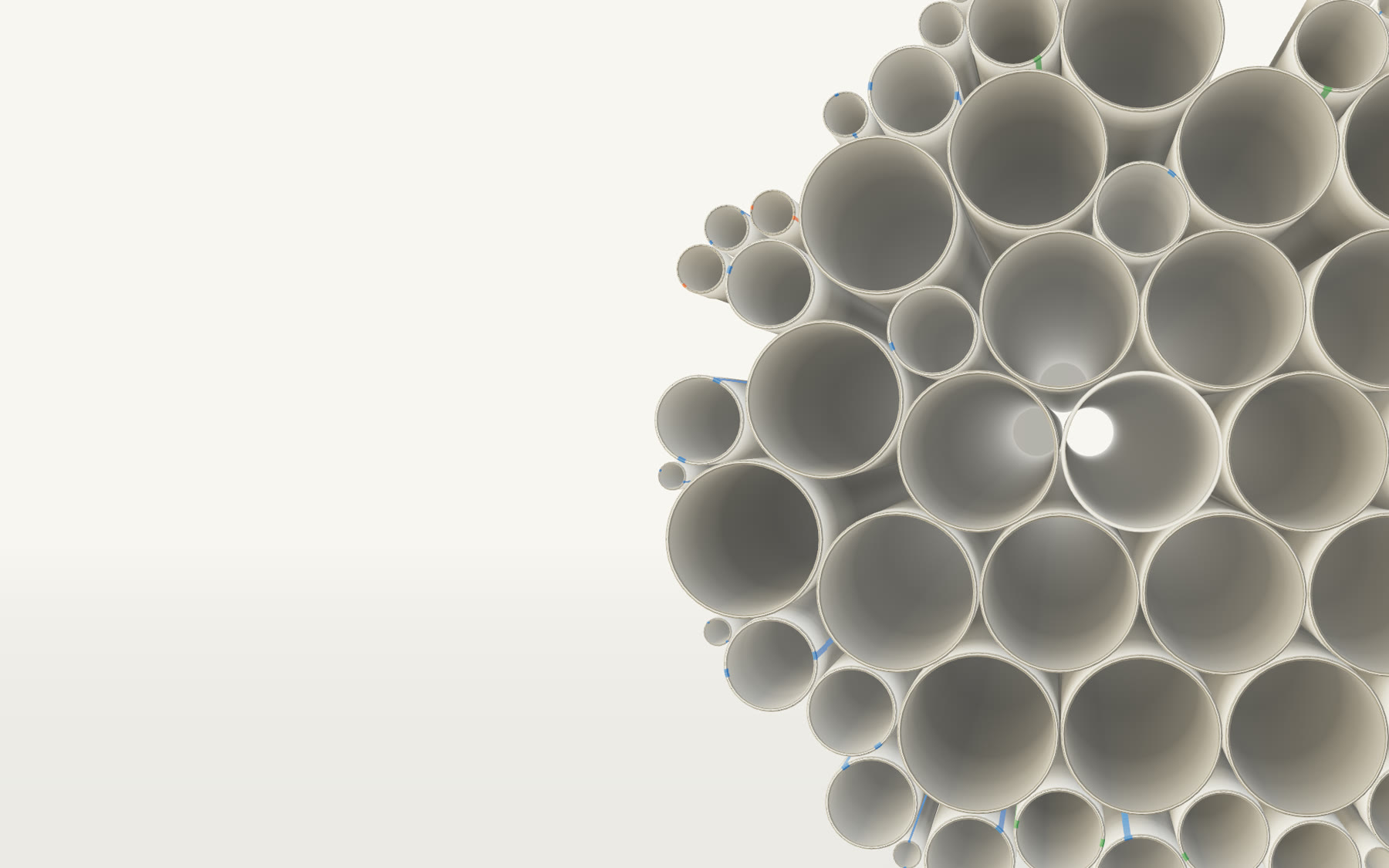 The Trumac website hero at rest: a packed stack of white uPVC pipe seen end-on